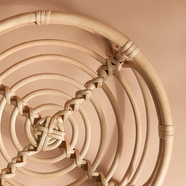 Intricate handwoven rattan basket, showcasing natural texture and craftsmanship.