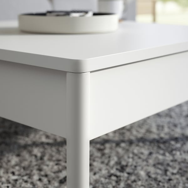 Off-white TONSTAD coffee table with sleek edges. Two soft-close drawers on each side. Simple, modern design.