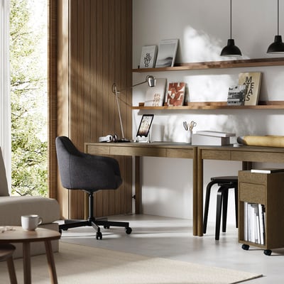 Modern home office with TONSTAD oak desk, black chair, and shelves. Large window for natural light.