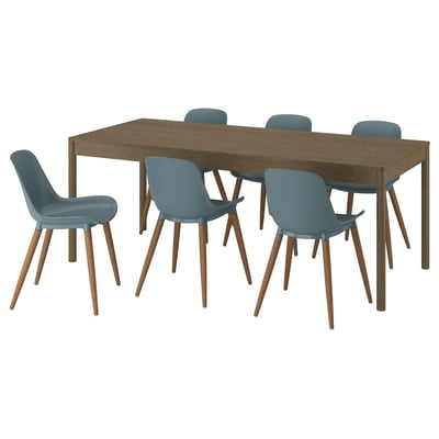 A dining set with a brown wooden table and blue plastic chairs.