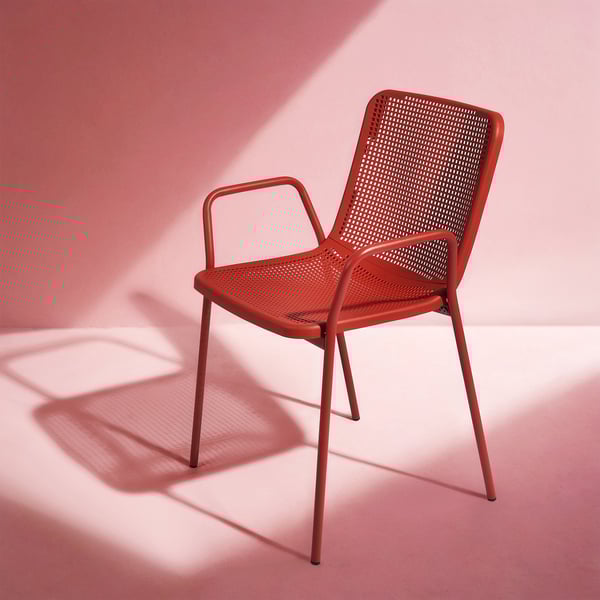 Red TORPARÖ outdoor chair, sleek & perforated design, metal & plastic, compact yet sturdy.