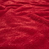 Soft, red fleece fabric, close-up texture, cozy and warm.