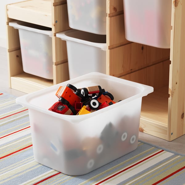 A toy storage bin with a wooden frame, holding several plastic boxes. One box is in front, filled with colorful toys.