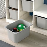 Storage bins on shelves, toys organized, easy access.
