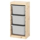 An IKEA TROFAST storage unit with three white bins in a light wooden frame.