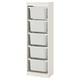 Displays an off-white TROFAST storage unit with five removable plastic boxes, ideal for organizing toys.