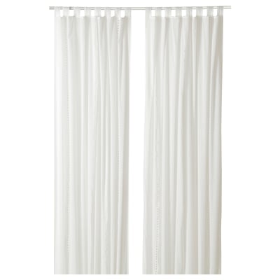 White sheer curtains with embroidered dots, featuring tab headings for easy hanging.