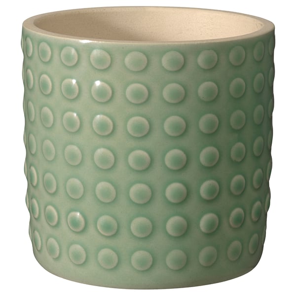 A green TYSKLÖNN ceramic planter with a textured, dotted design, ideal for plants.