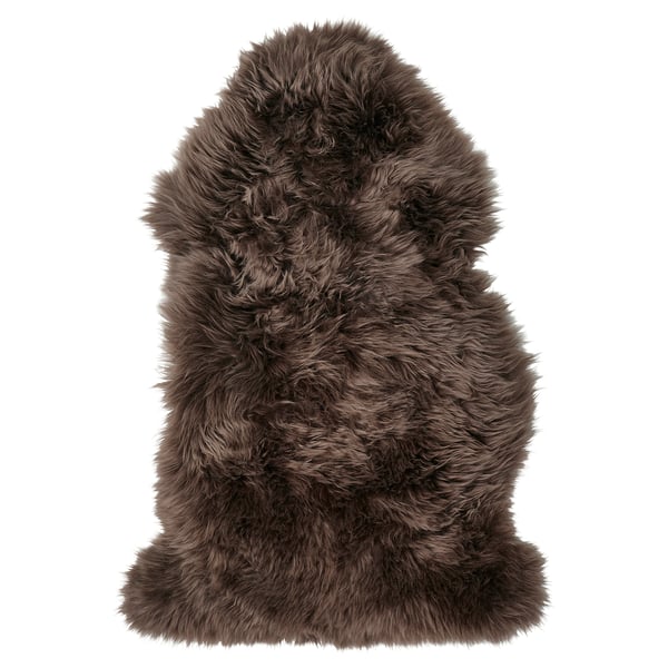 ULLERSLEV sheepskin rug, brown, fluffy, rectangular, cozy, natural texture.