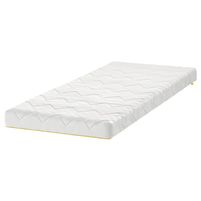 A white UNDERLIG junior mattress with a quilted surface. It is rectangular and a child-safe zipper design.
