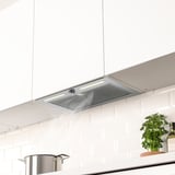 Stainless steel range hood with led lights hidden in kitchen cabinet, offering a clean look and effective ventilation.