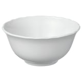 White porcelain bowl, ruffled edge, round shape, simple design.