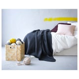 Bed with gray VÅRELD cotton bedspread and basket of yarn.