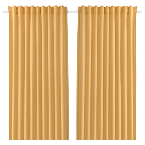 Two beige curtains hang side by side. They are solid, rectangular, and feature a rod pocket design, typically used for privacy and light control.