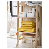 Simple wooden bathroom shelf, storing yellow towels & white bins, made of birch, modern minimalist design.