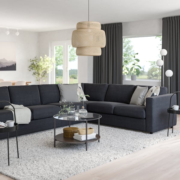 L-shaped VIMLE sectional sofa in cozy living room with large window, pendant lamp, and decor.