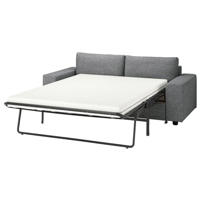 Grey VIMLE sofa-bed with white mattress, textured fabric, modern design.
