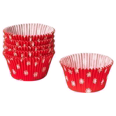 Two red christmas-themed muffin cups, one large and one small, with white snowflake designs. Made from chlorine-free paper, shaped for baking treats.