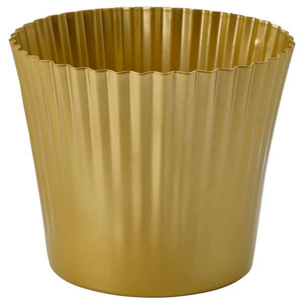 Gold-colored metal planter with ribbed design for holding plants.