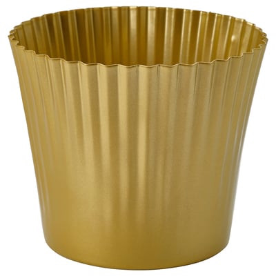 Gold-colored metal planter with ribbed design for holding plants.