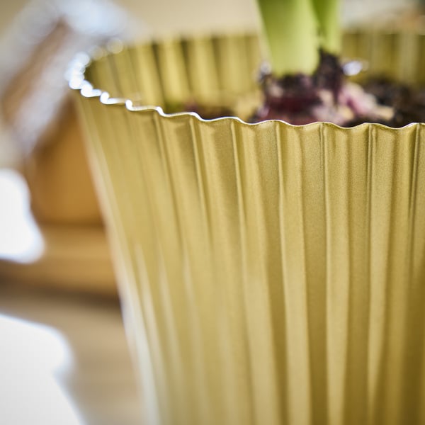Gold fluted planter with plant