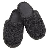 Black cozy slippers, textured knit design, foam sole for comfort and grip.