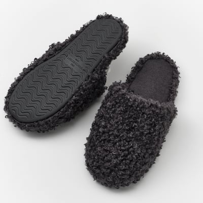 Pair of black VINTERFINT slippers with textured sole for grip.
