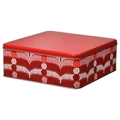 Red square tin box with red lid, decorated with white floral pattern, ideal for storing treats.