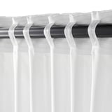 Black curtain rod with white sheer curtains partially drawn; hooks visible.