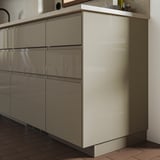 VOXTORP cabinet in light beige with glossy finish and plastic edging, sleek and modern design.