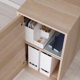 Vista de configuración de la unidad ALEX con cajas de almacenamiento y compartimentos organizados.
