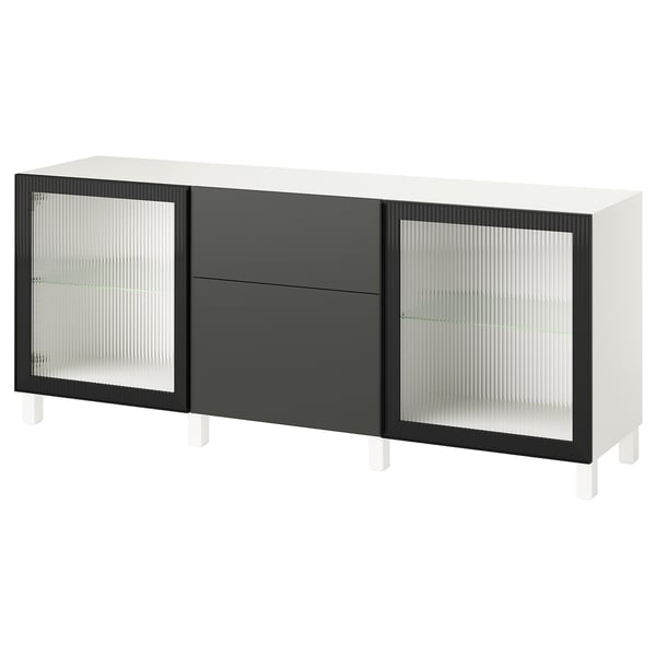 Moderno mueble de almacenamiento BESTÅ, blanco y negro. 2 puertas de vidrio y 1 cajón. Diseño elegante y rectangular para la organización del hogar.