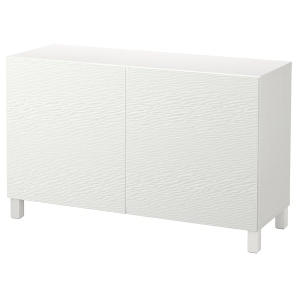 Mueble de almacenaje BESTÅ blanco: diseño rectangular moderno con dos puertas, patas de madera y líneas limpias para una decoración versátil.