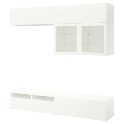 Mueble de TV BESTÅ blanco: armarios de pared y bajos con puertas de cristal, diseño minimalista y elegante, estantes ajustables.