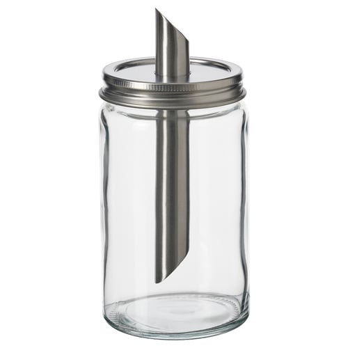 Una azucarera de vidrio transparente vacía con tapa de acero inoxidable y cámara de aire de metal, diseñada por IKEA.