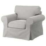 Sillón gris EKTORP, diseño elegante, tejido suave, forma curva.