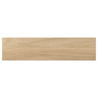 Un panel de madera en color roble claro, rectangular, con superficie lisa de lámina.