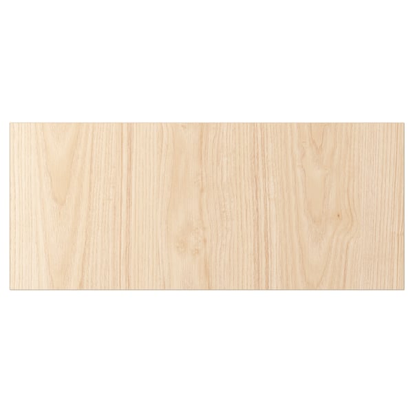 Un panel rectangular de madera de color ceniza claro de la serie FÄNRIK. Es una superficie de melamina para mayor durabilidad y fácil limpieza.