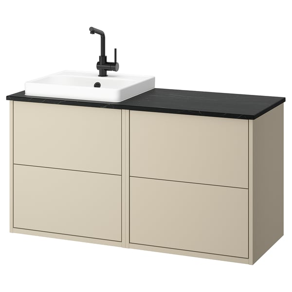 Mueble de baño HAVBÄCK beige con encimera negra y lavabo cuadrado blanco.