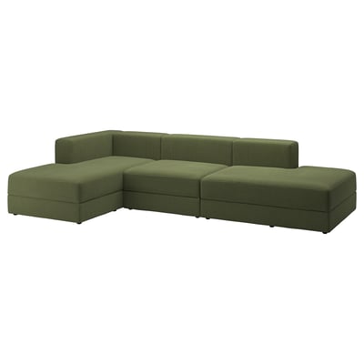 Un sofá modular JÄTTEBO verde con tumbona esquinera y asientos adicionales, con una funda de tela de pana y un diseño cómodo y acogedor.