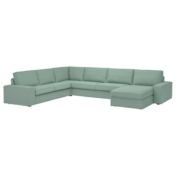 Sofá modular KIVIK verde claro con reposabrazos bajos y cojines profundos, diseñado para la comodidad y la relajación.