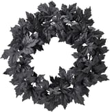 Corona negra con hojas oscuras, forma circular, diseño decorativo de halloween.