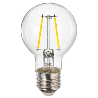 Bombilla LUNNOM de Ikea, cristal transparente, filamento amarillo, forma esférica.