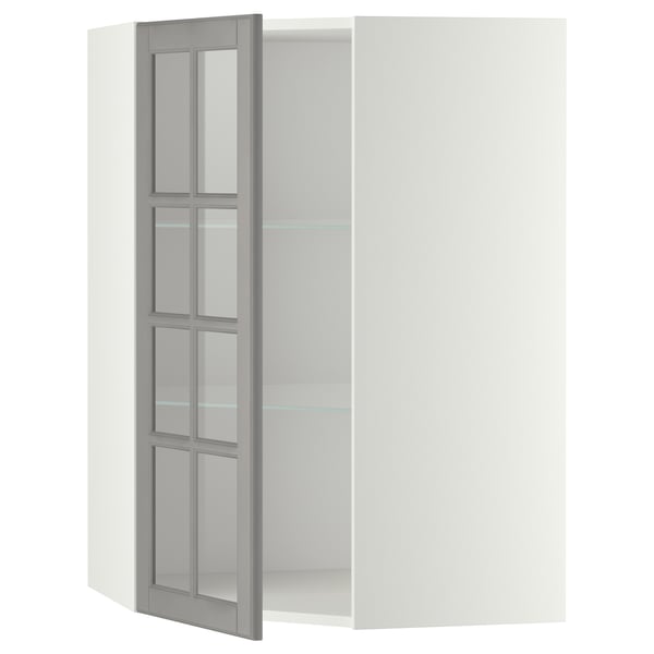 Mueble de cocina METOD blanco abierto con puerta de cristal bodbẙn gris con bordes biselados.