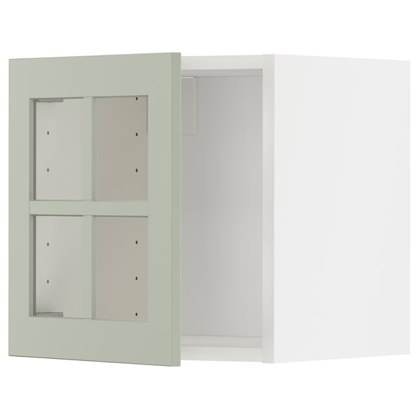 Mueble de pared verde METOD con puertas de cristal.