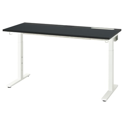 Un escritorio negro de altura ajustable, MITTZON, con tapa oscura y patas blancas. Cuenta con gestión de cables y ajustes de altura ajustables para una comodidad ergonómica.