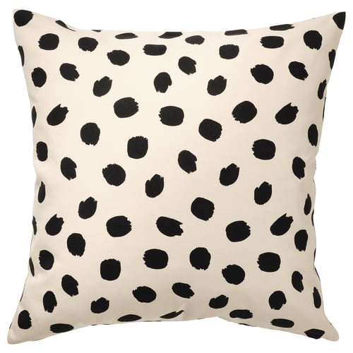 Almohada cuadrada, blanco roto con puntos negros, diseño divertido.