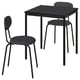 Mesa y sillas de arenado negro. Diseño moderno, patas metálicas, asientos acolchados.