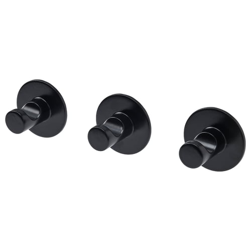 Tres elegantes ganchos de pared negros, forma circular, reverso adhesivo fácil para un montaje sin herramientas.