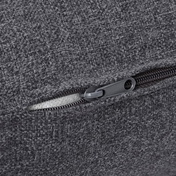 Primer plano de tela gris texturizada duradera con cremallera de calidad; probablemente de un sofá o de un bolso.